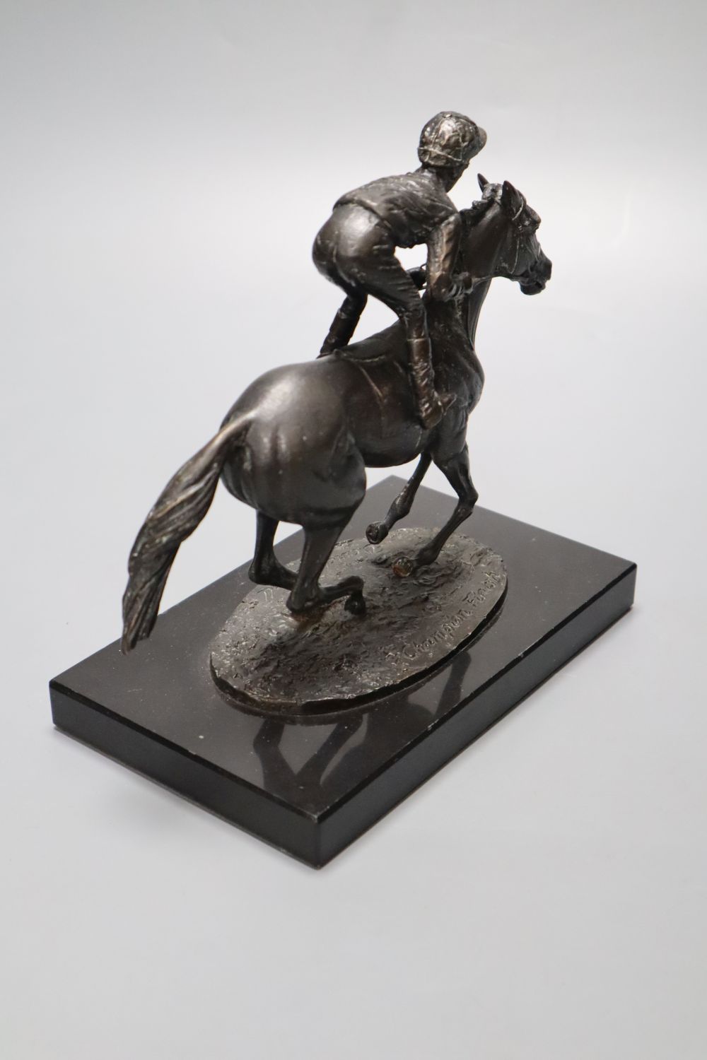 David Cornell, 1985. A cast bronze racehorse and jockey, entitled Champion Finish, on slate plinth, height 20cm